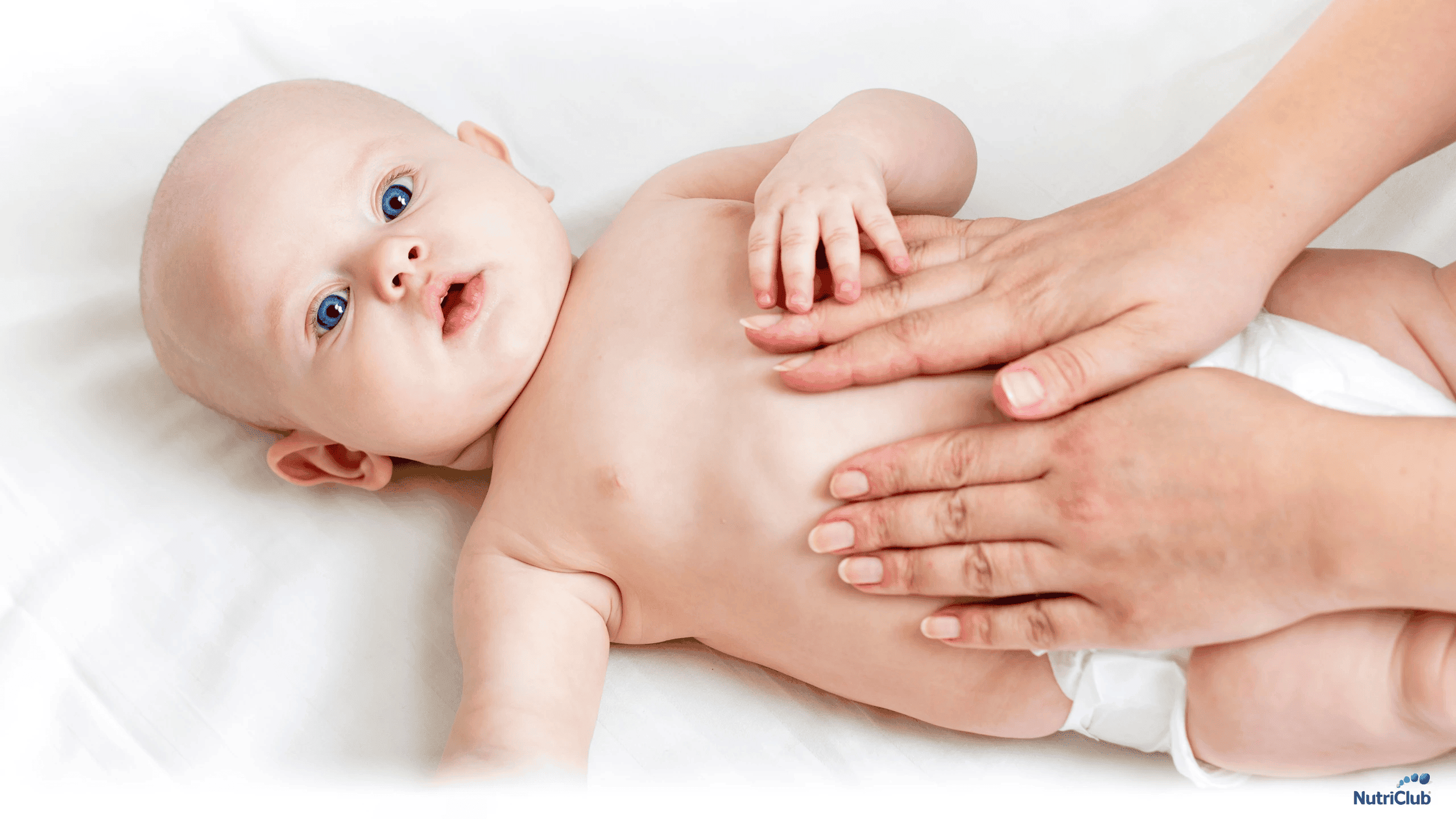 Baby having his tummy massaged